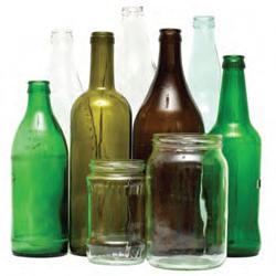 Organized recyclable glass bottles including mason jars and pop bottles.