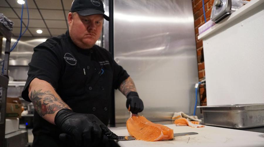 Dustin Schmidt skinning salmon